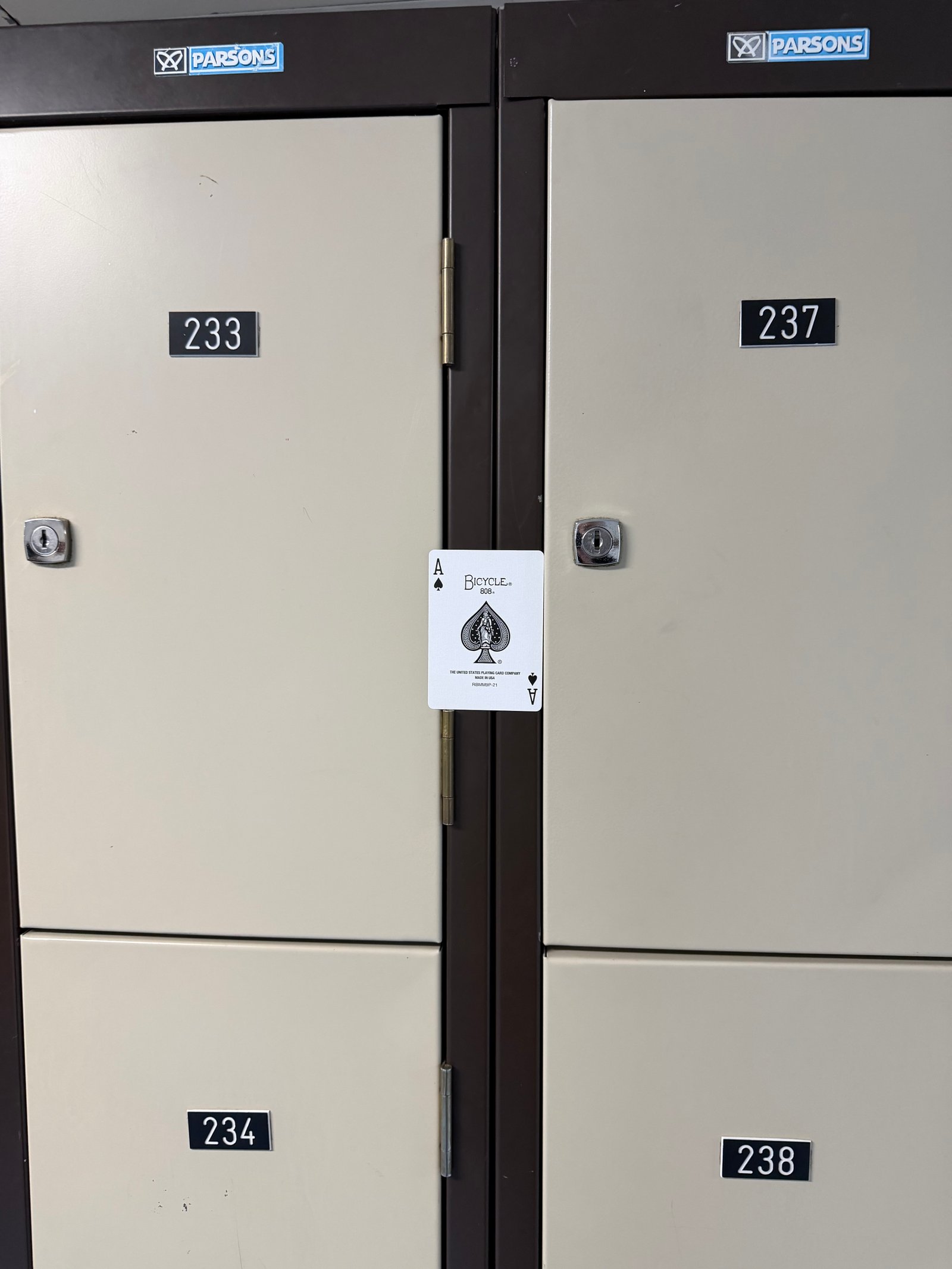An Ace of Spades resting between two lockers at Boherbue Comprehensive School