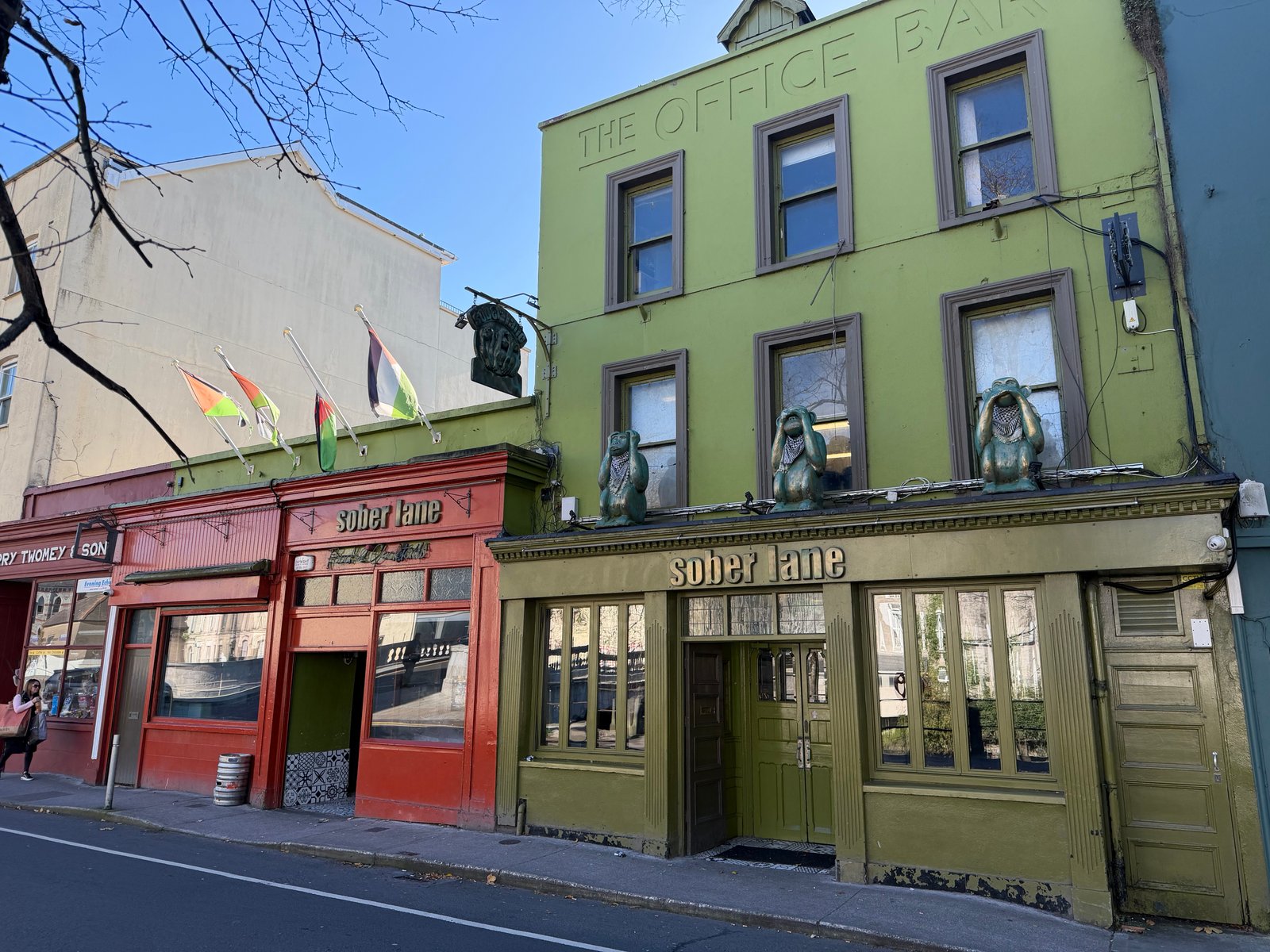 The green facade of Sober Lane on the street in Cork city